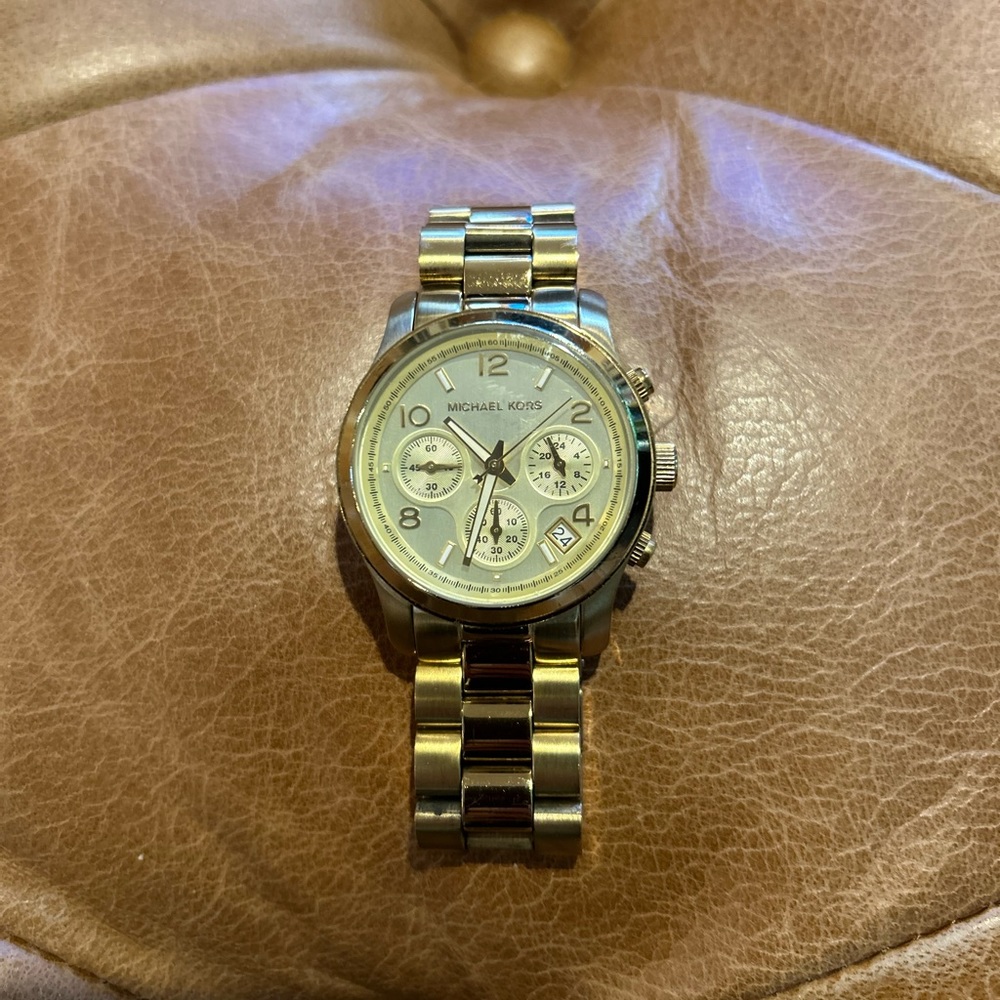 Gold tone Michael Kors watch.